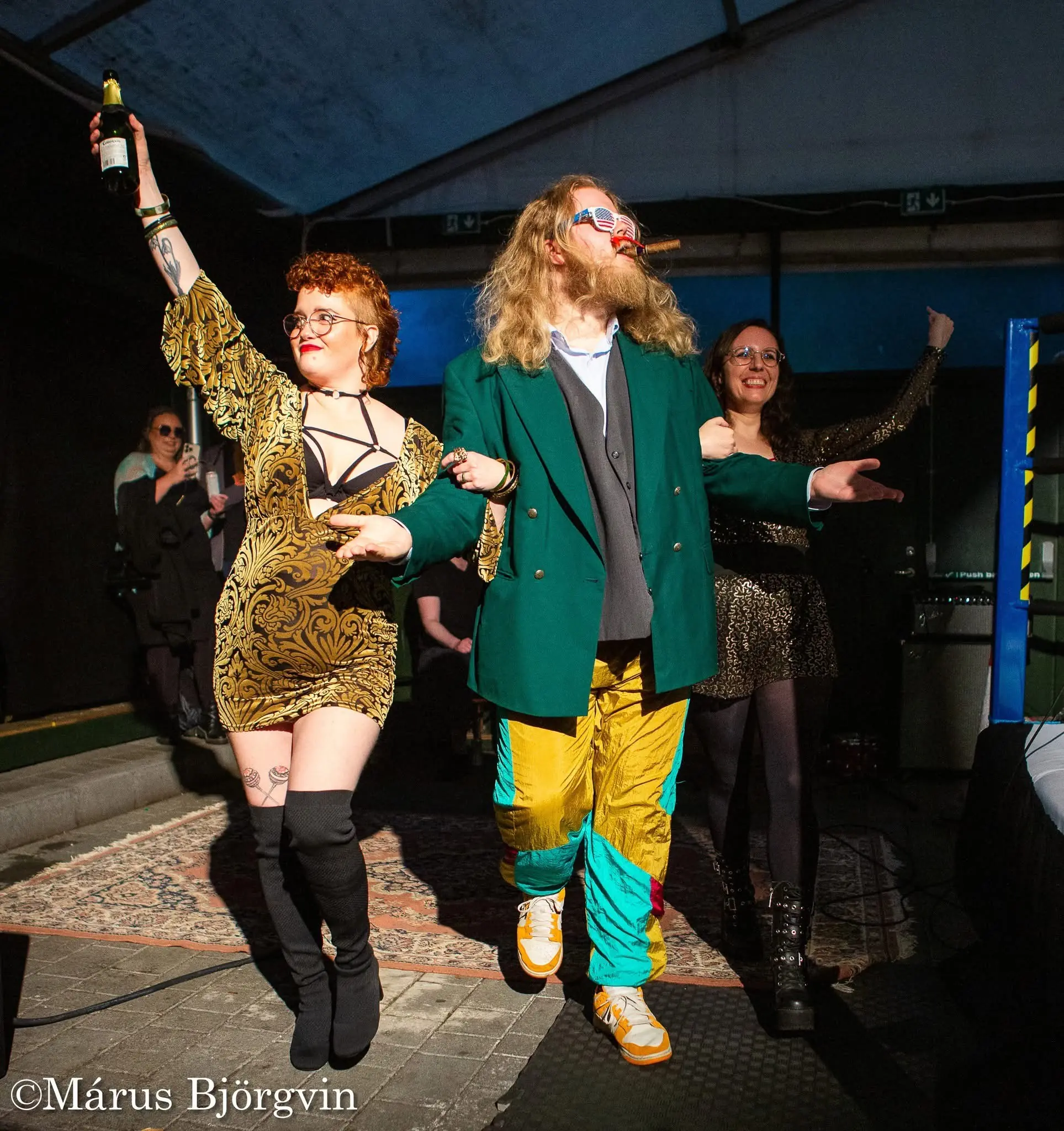 A crew of managers and valets outside the ring